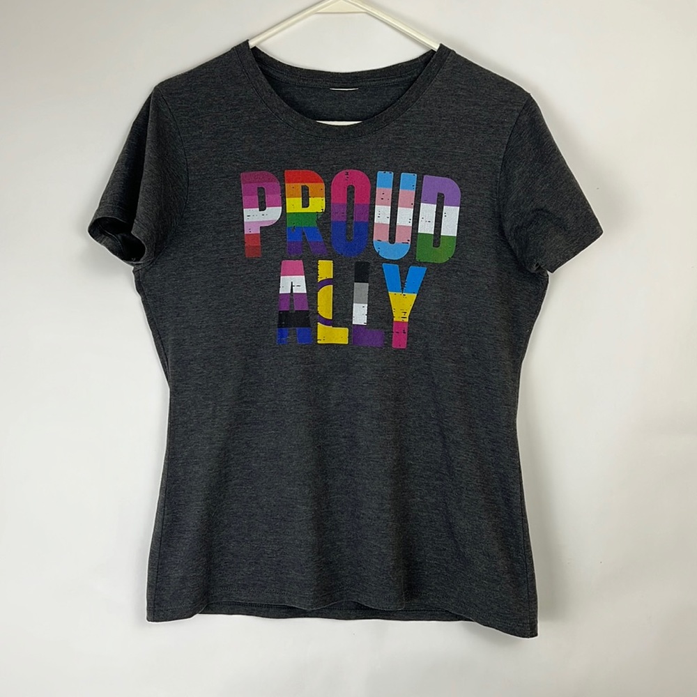 PROUD ALLY women’s tee in dark heathered gray with multi-color lettering…